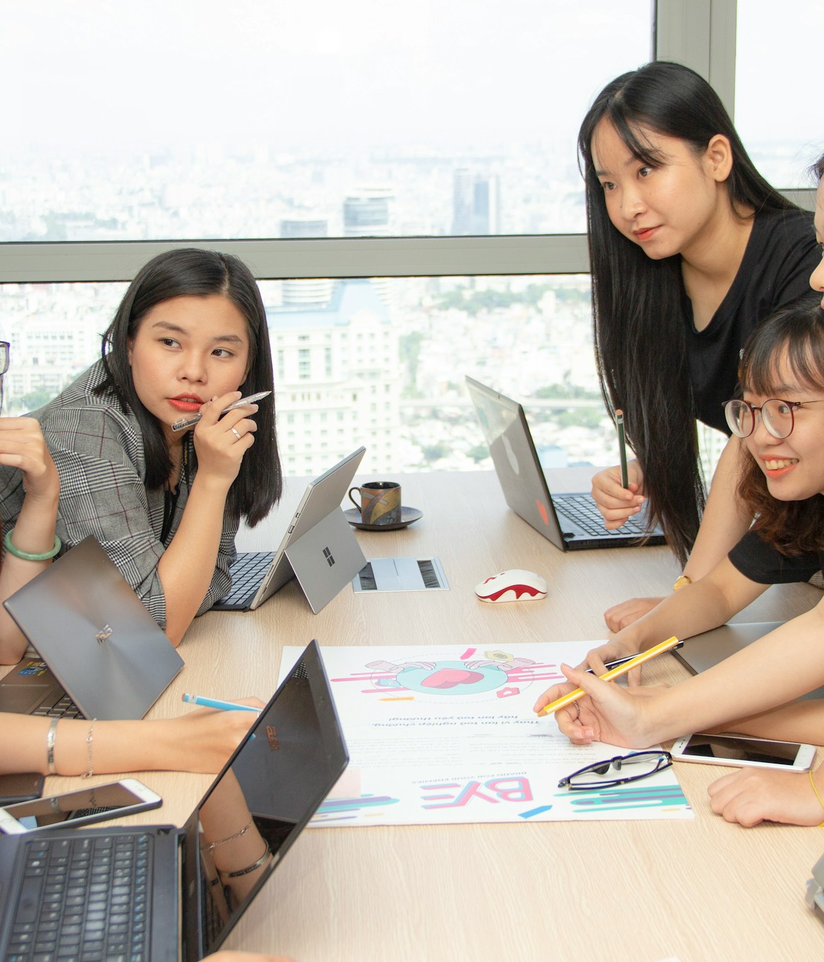 Designers and developers collaborating during a project planning session, showcasing teamwork and dedicated software development expertise.