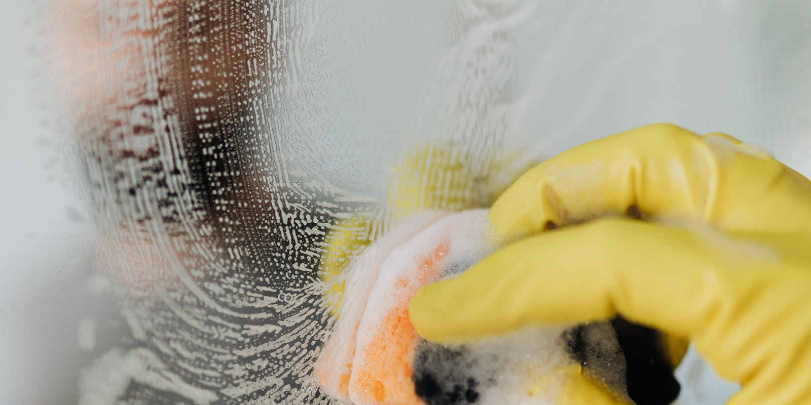 cleaning the mirror with soap