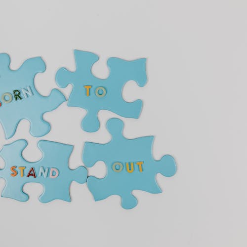 Tall slender porcelain bottle with natural clay textured body and cork stopper.