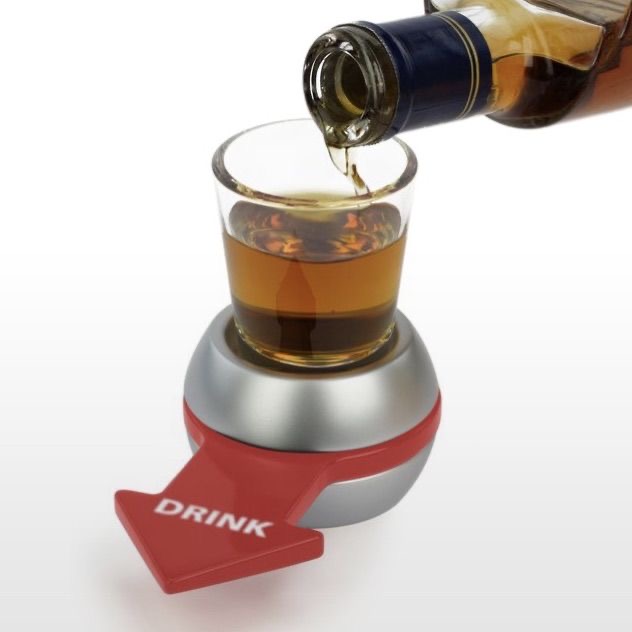 Jeu Spin the Shot avec un verre à shot rempli et une flèche rouge indiquant 'Drink
