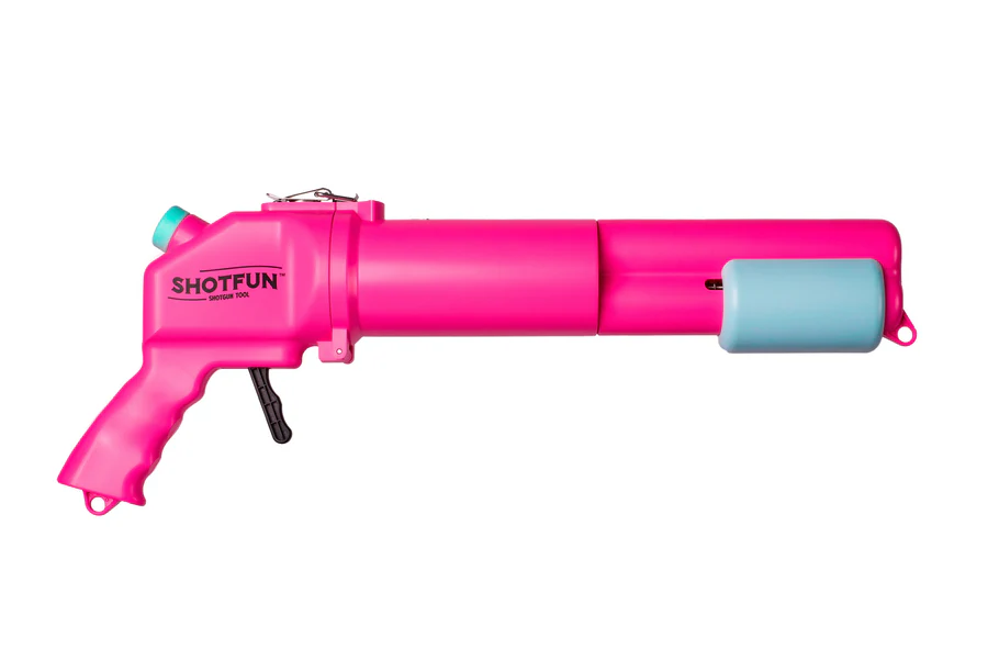 Pistolet à cul sec rose vif, idéal pour des jeux de soirée et des défis entre amis
